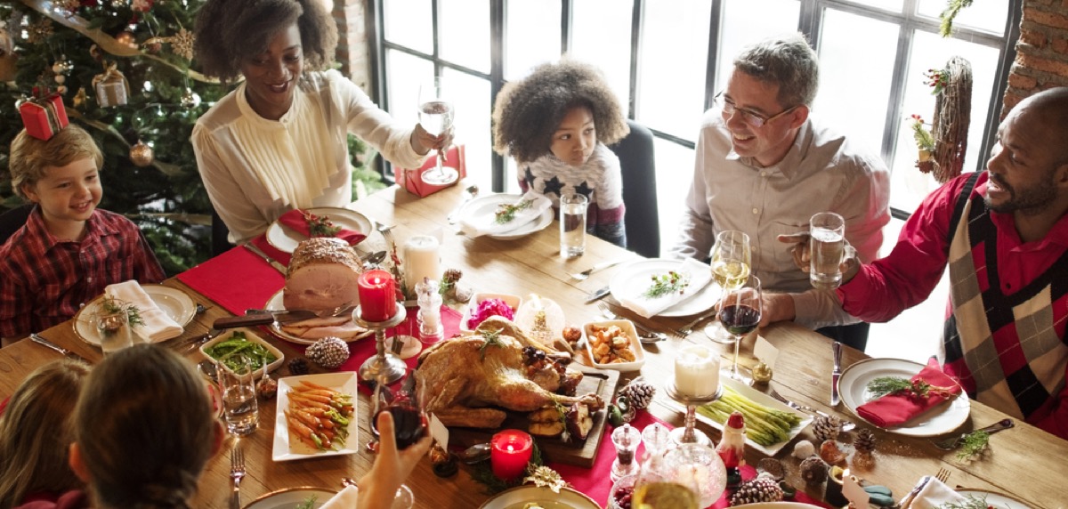 https://bestlifeonline.com/wp-content/uploads/sites/3/2019/11/multiracial-family-celebrating-christmas.jpg?quality=82&strip=all