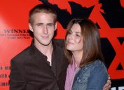 Sandra Bullock posing with Ryan Gosling at the premiere of The Believer at the Director Guild of America in Los Angeles. September 6, 2001