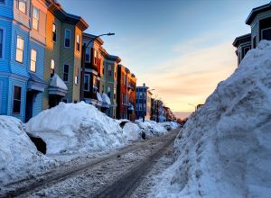 Large snowbanks in the South Boston Southie neighborhood of Boston. Boston is the largest city in New England, the capital of the state of Massachusetts.