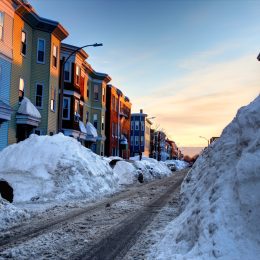 Large snowbanks in the South Boston Southie neighborhood of Boston. Boston is the largest city in New England, the capital of the state of Massachusetts.