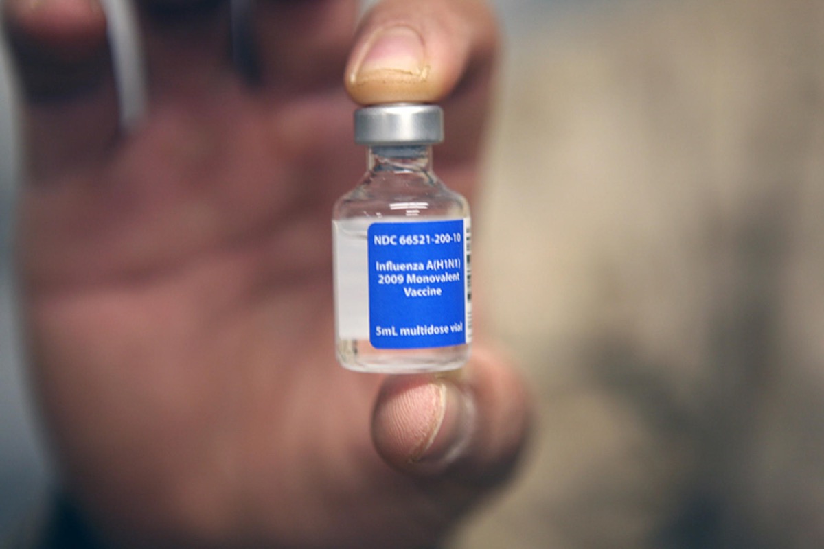 The H1N1 vaccine closeup in person's hand to combat swine flu in 2009.