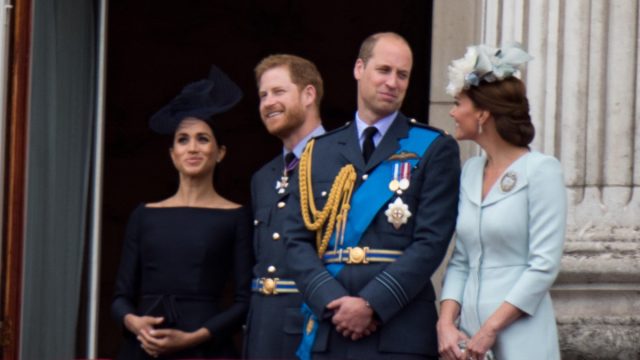Meghan, Harry, William, and Kate watch the RAF 100 celebrations from the balcony at Buckingham palace.