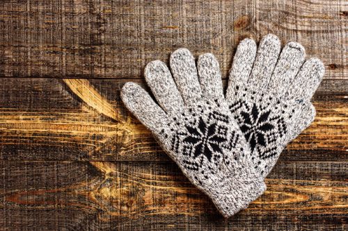 gray winter gloves with black snowflake pattern
