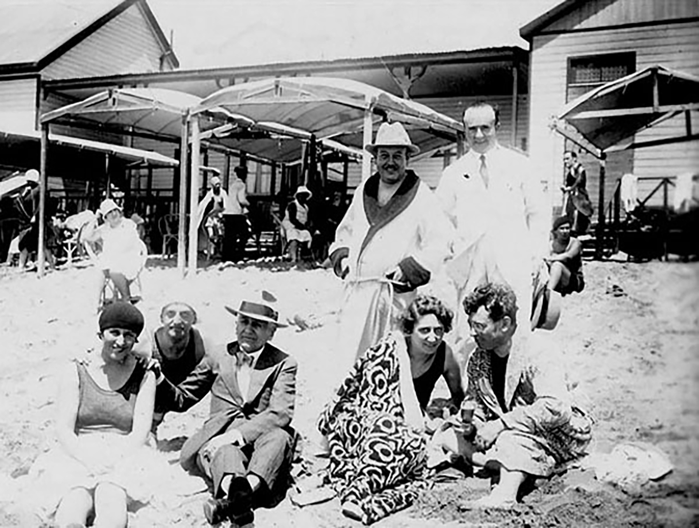 a group of beachgoers in the 1930s