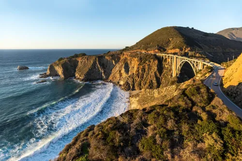 bridge between two cliffs along a coastline