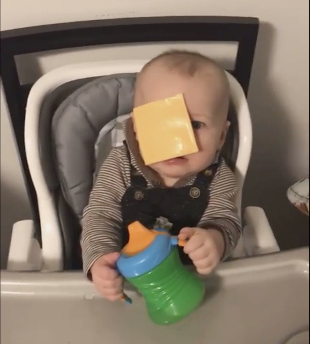baby with cheese on his face