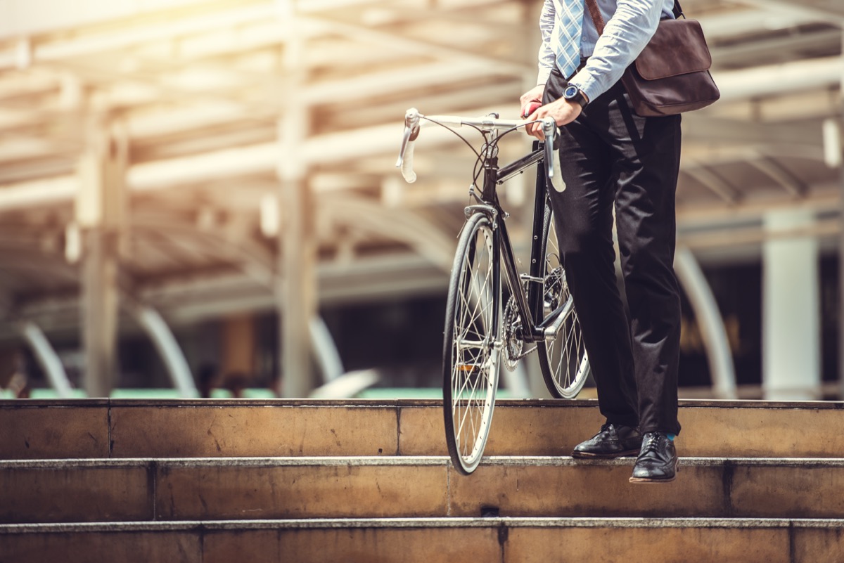 Businessman riding his bicycle to work for an active commute