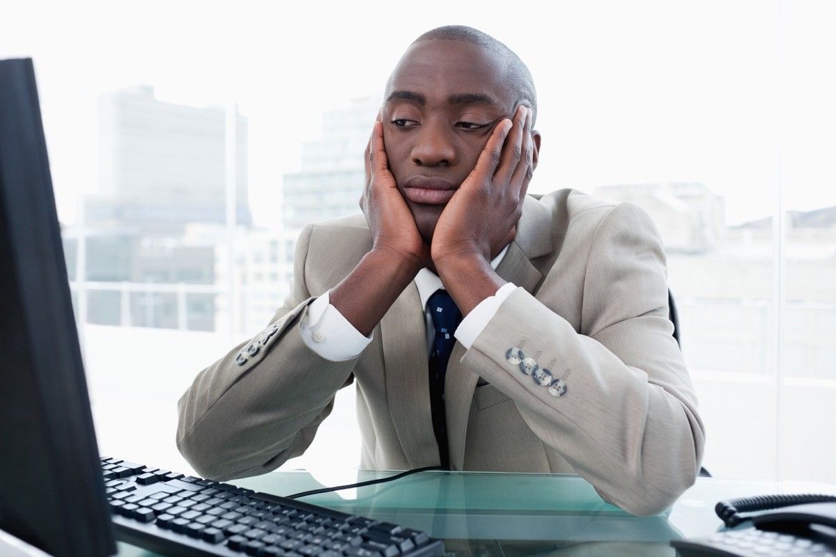 bored businessman looking at his computer