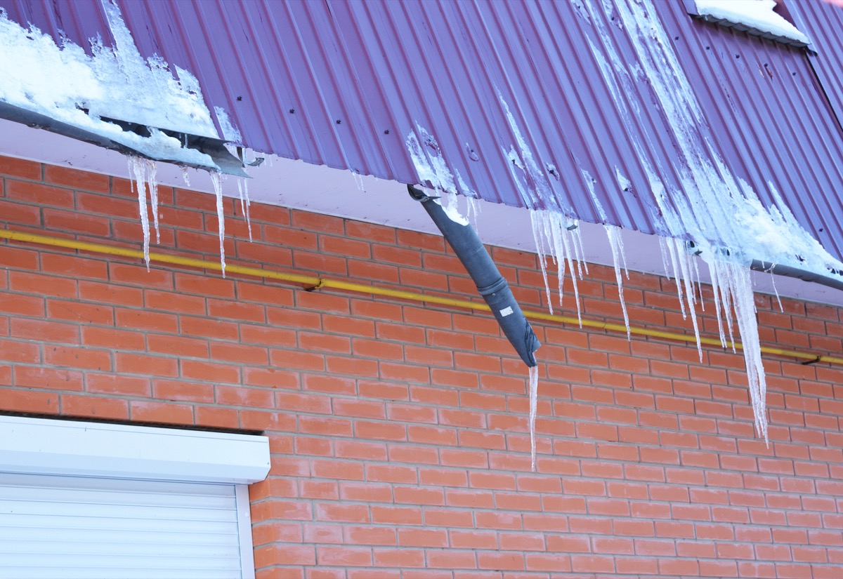 falling gutter and icicles