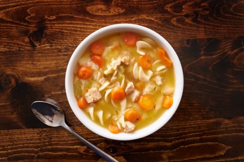 chicken noodle soup on wooden table