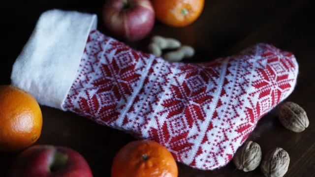 christmas stocking with nuts apples and oranges