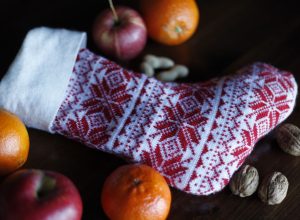 christmas stocking with nuts apples and oranges