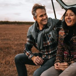 man surprising his wife with a outdoor sunrise trip