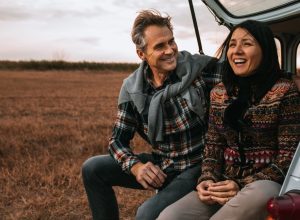 man surprising his wife with a outdoor sunrise trip