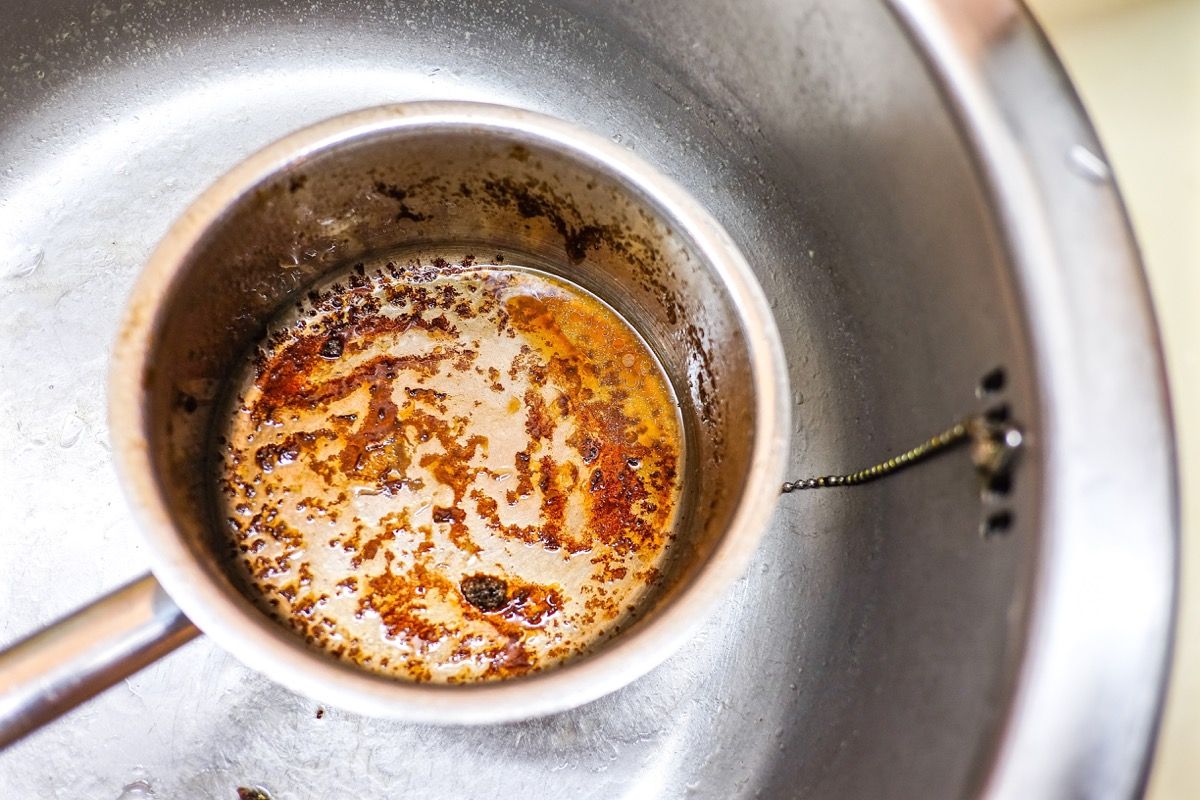 dirty pot or pan in sink