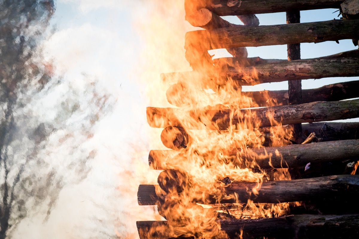 fire burning on staked wood logs