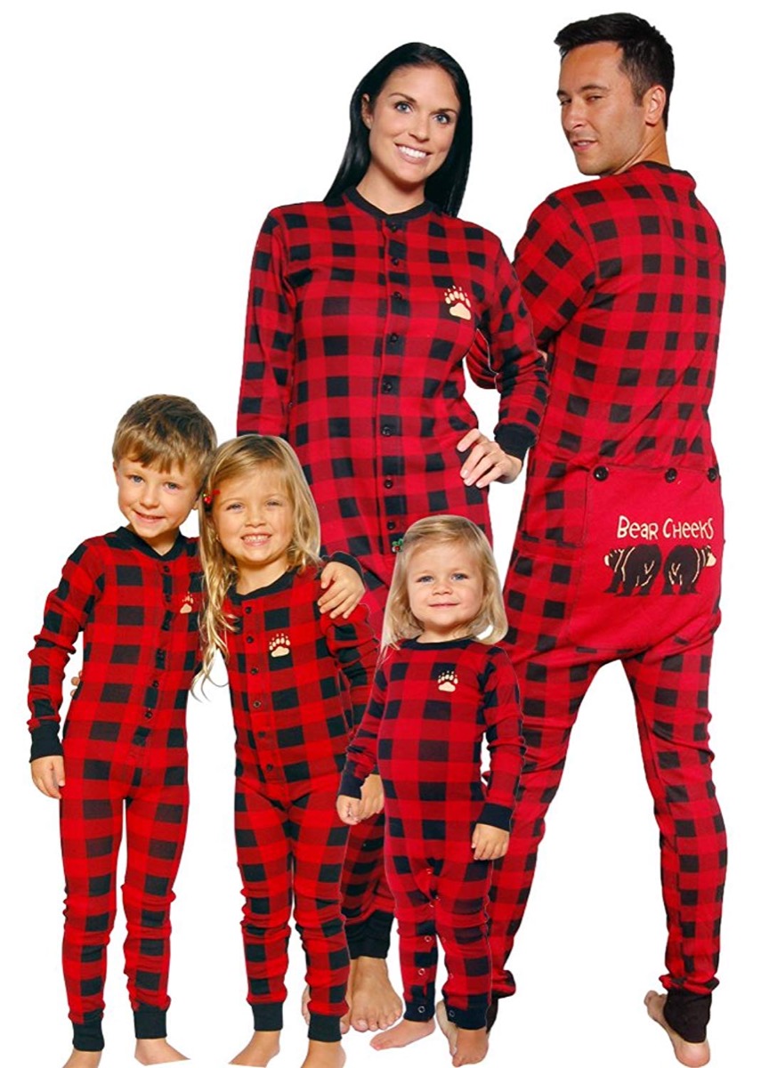 family with three kids in red and black pajamas with a flap on the butt
