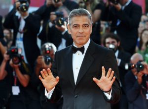 George Clooney posing on the red carpet