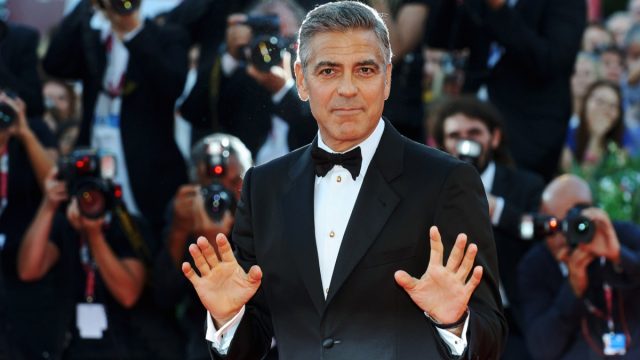 George Clooney posing on the red carpet