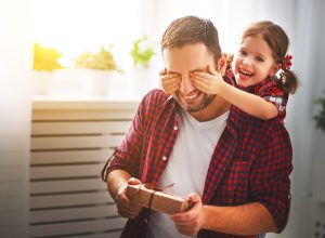 little girl surprising dad