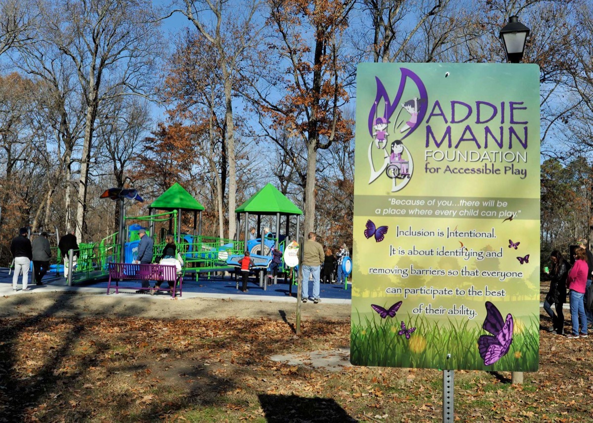 maddie mann park sign in front of accessible playground