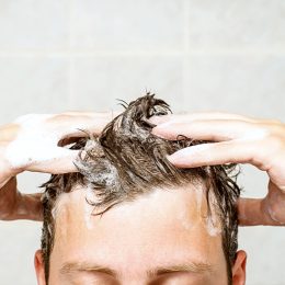 man washing his hair