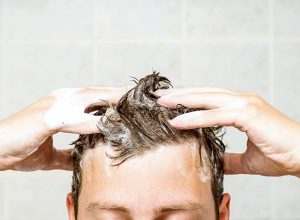 man washing his hair