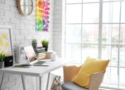 modern office with yellow pillow on white chair