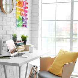 modern office with yellow pillow on white chair