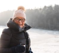 Older woman happy outside in the winter