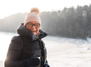 Older woman happy outside in the winter