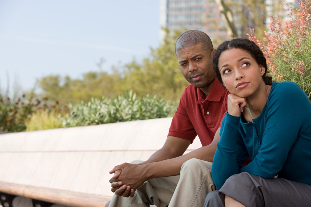 middle aged black couple sitting outside