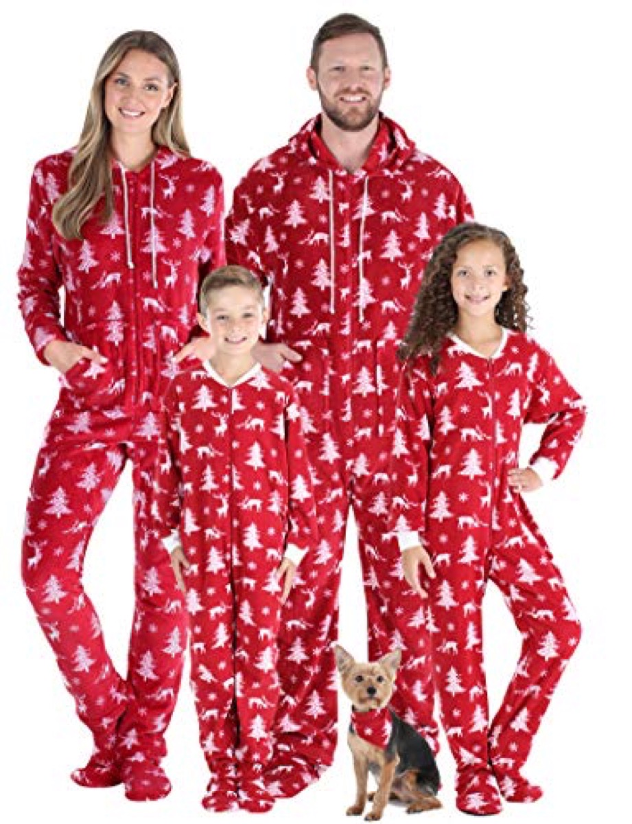mother, father, and two children in red and white pajamas
