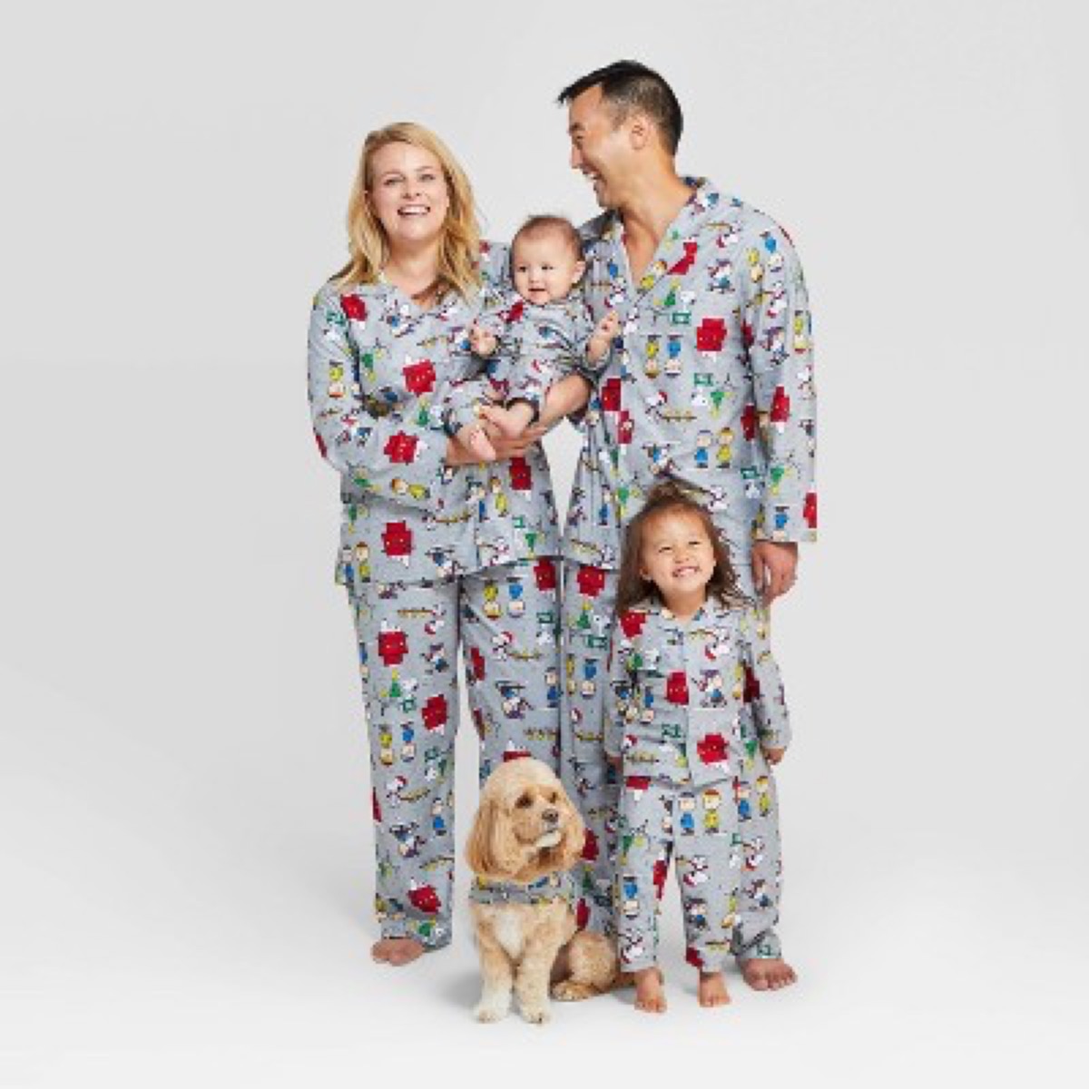 man, woman, two children, and dog in gray peanuts pajamas