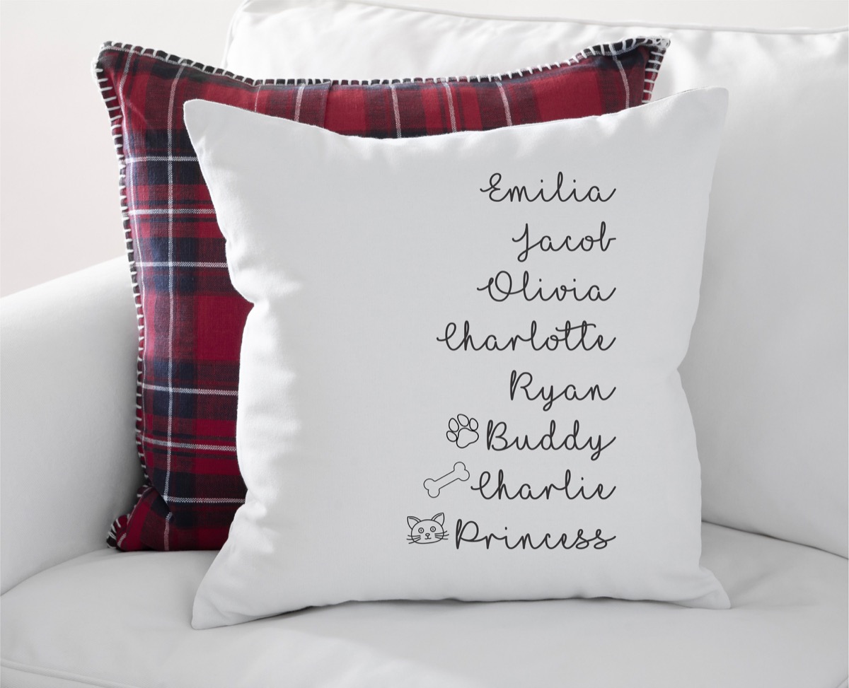 personalized white pillow with cursive names on it