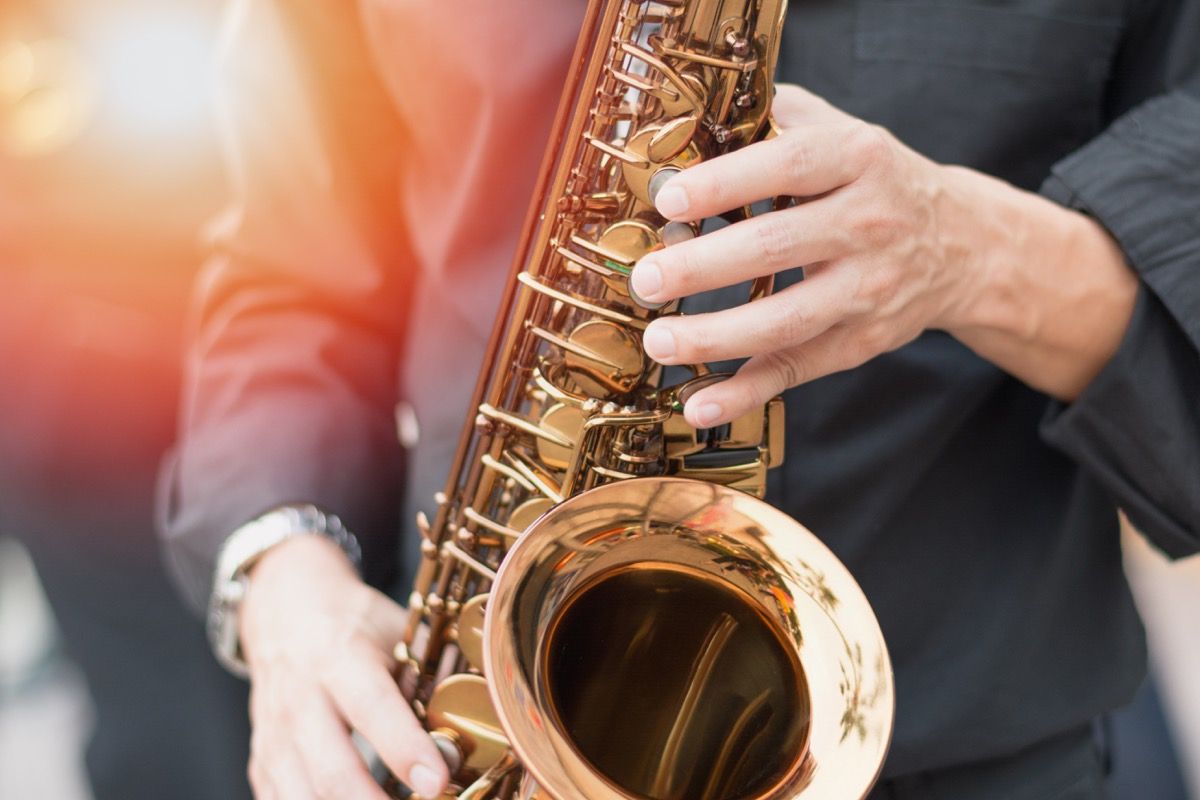 A person who store plays musical instruments