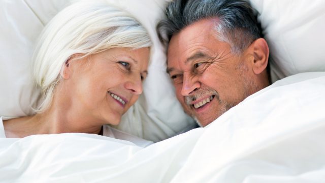 senior couple in bed together