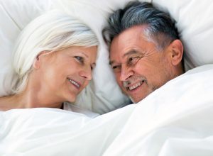 senior couple in bed together