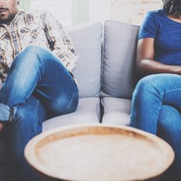 unhappy couple on couch