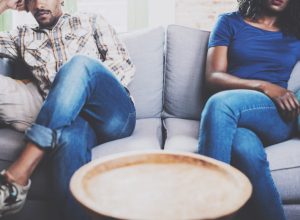 unhappy couple on couch