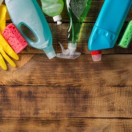various cleaning products on wooden table