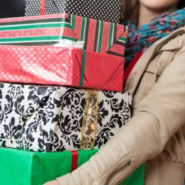 woman holding multiple gift boxes