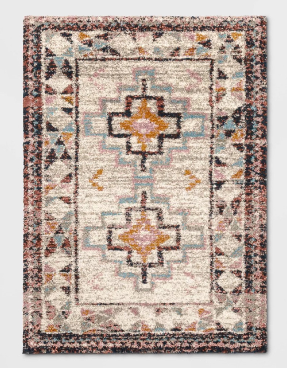 white pink and blue rug