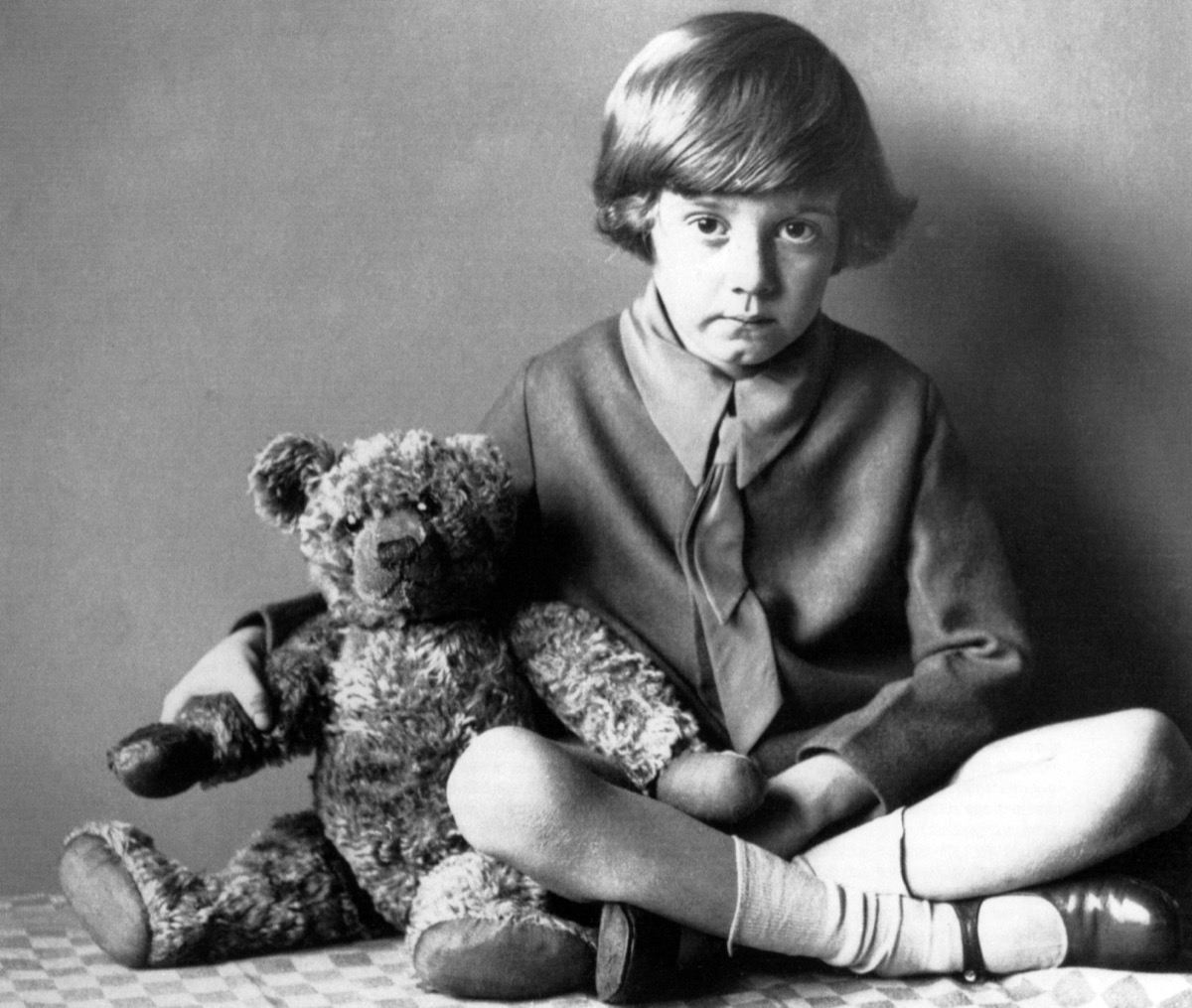 christopher robin milne holding his teddy bear