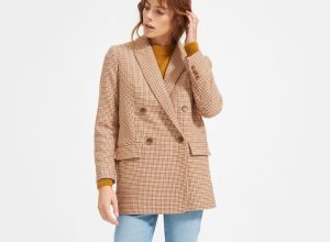 Woman wearing herringbone blazer