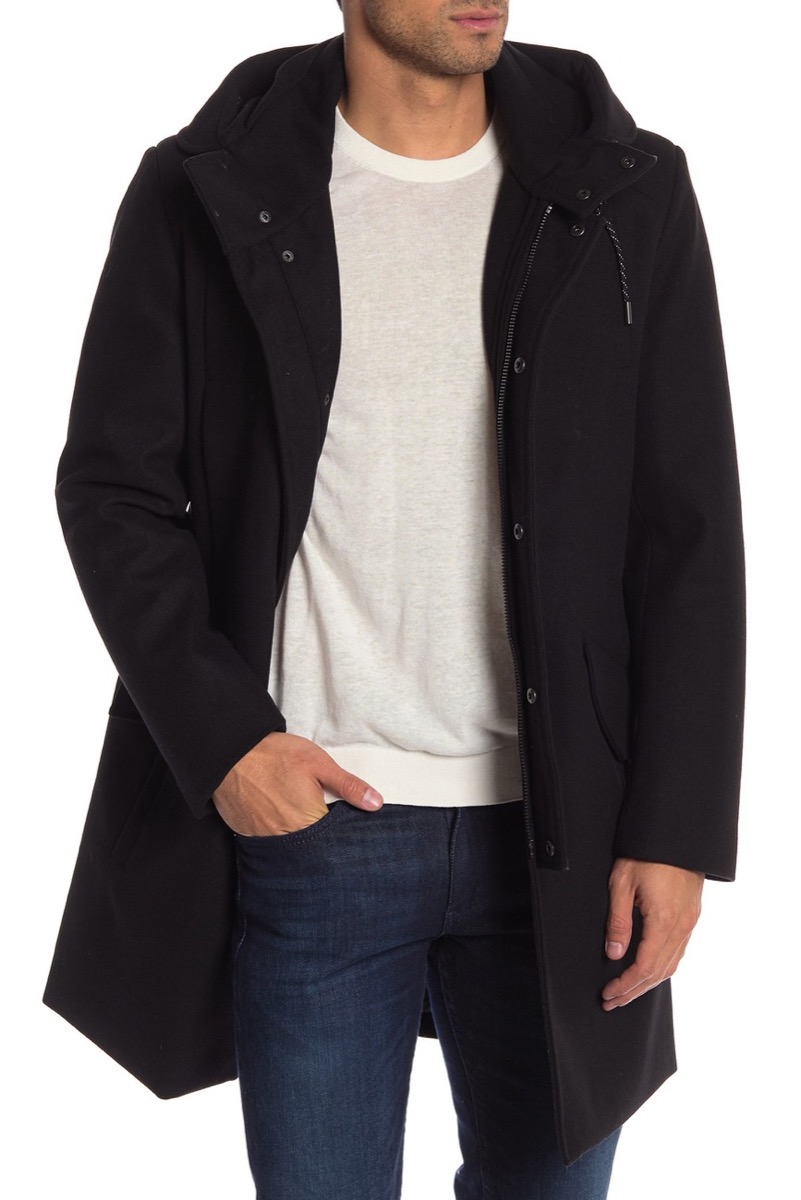Man wearing black hooded coat