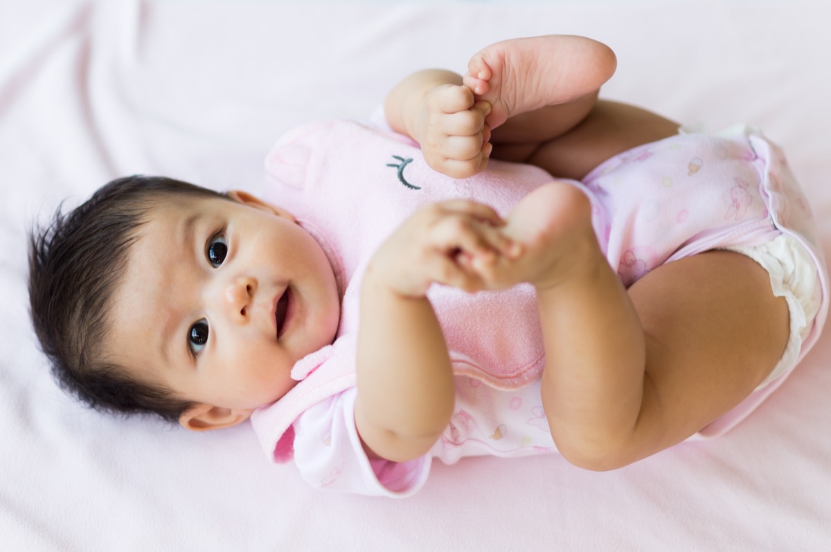 asian baby in pink onesie