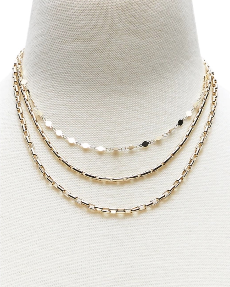 gold multi-strand statement necklace on mannequin neck