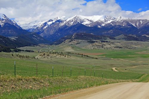 the road from big timber town leading to the crazy mountains in montana