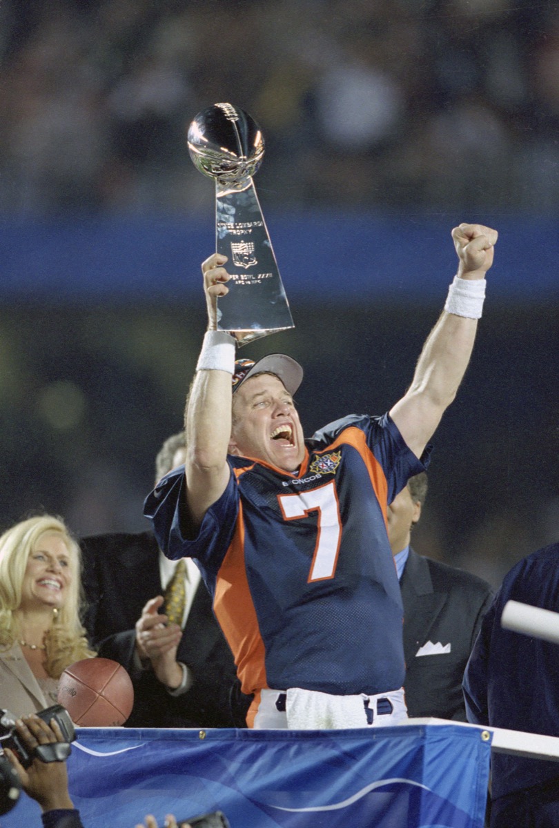 John Elway of the Denver Broncos celebrates his first Super Bowl victory over the Green Bay Packers at Qualcomm Stadium in 1998.